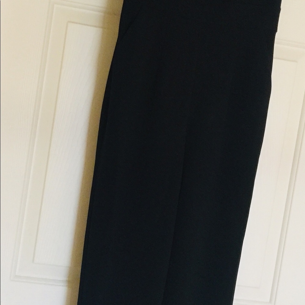 Dressy black jumpsuit, ruffles and pockets, good